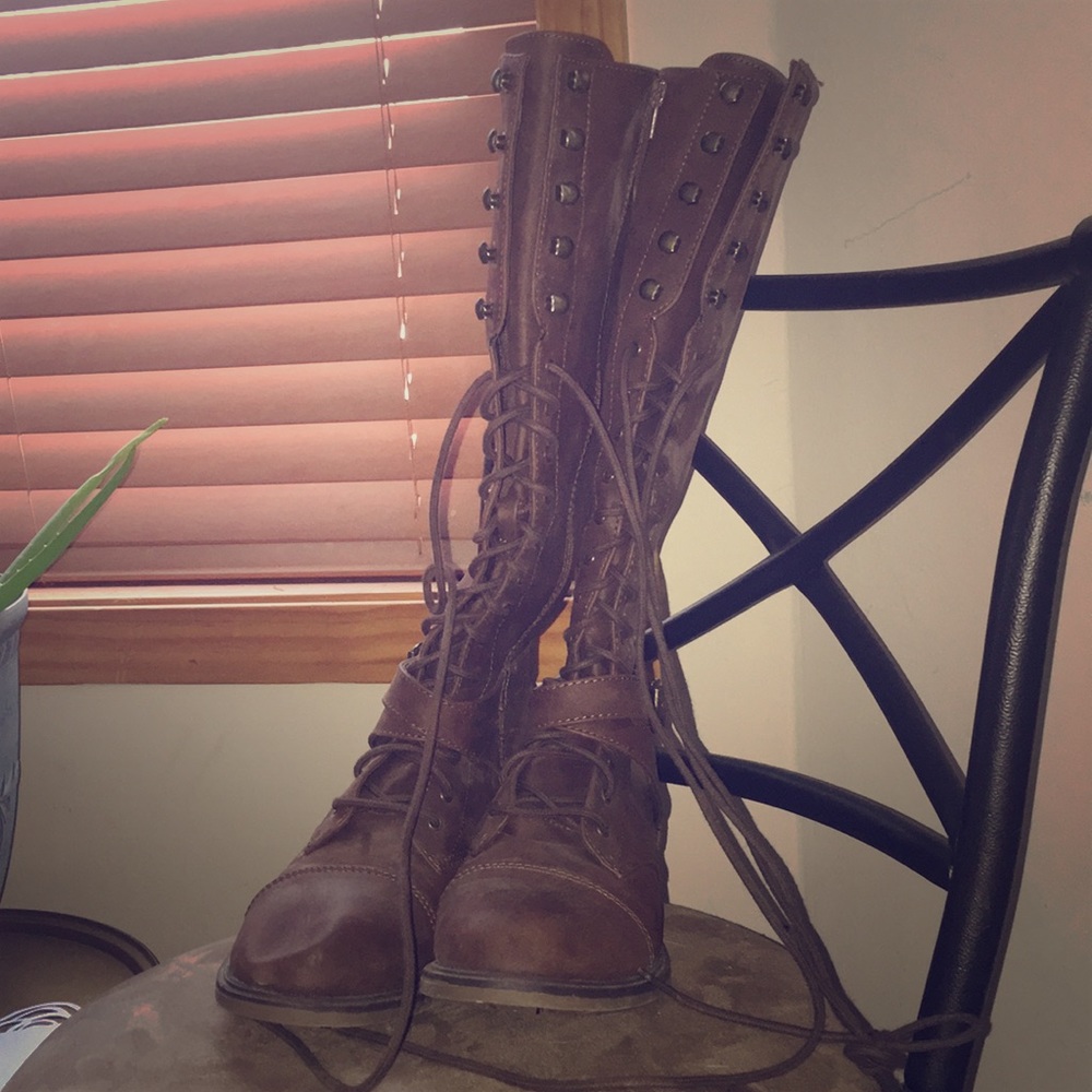 Tall combat boots.